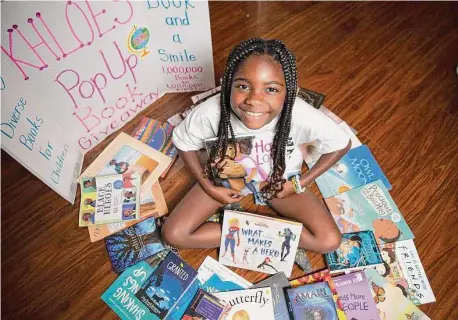  ?? Yi-Chin Lee / Staff photograph­er ?? Khloe Joiner, 10, a fifth grader at Palmer Elementary School, has been donating books since she was 4.