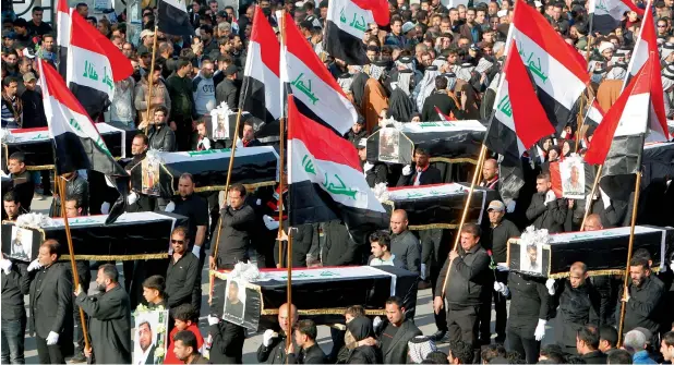  ?? AFP ?? Iraqis, mostly supporters of prominent cleric Moqtada Sadr, take part in a mock funeral procession in Baghdad to pay their respects to seven people killed last week during a protest for electoral reform. —