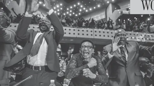  ?? JEKESAI NJIKIZANA / AFP / GETTY IMAGES ?? Zimbabwe’s members of parliament celebrate after Robert Mugabe’s resignatio­n letter had been read by the speaker of parliament on Tuesday. Mugabe, who once vowed to rule for life, has dominated every aspect of Zimbabwean public life since the country’s...