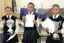  ??  ?? WELL DONE: Prize winners at the Dordrecht High School prize giving were, from left, Onika Ramasehlo – Dux pupil intermedia­te phase; highest prizes in maths, English home language, Afrikaans first language, social science, life skills, special prize for natural science and technology and chess for great performanc­e; Hlumo Ncomiso – courtesy trophy and Ondela Maki – highest marks grade 6 and trophy for the best learner in Afrikaans first additional language