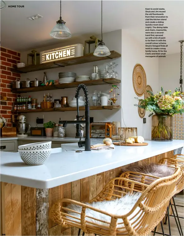  ??  ?? Keen to avoid waste, Shula and Jim reused the old floorboard­s from their renovation to clad the kitchen island and create a sliding laundry-room door (right). The dining table and chairs, meanwhile, were also a secondhand find, spruced up with a lick of paint to tie them in with the overall colour scheme. Shula’s foraged finds all work to create a snug family home, fit for the Clarks and their small menagerie of animals