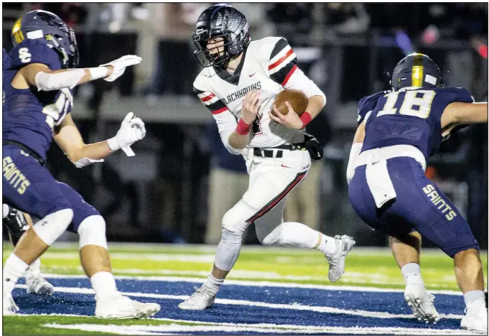  ?? File photo/Special to NWA Democrat Gazette/DAVID BEACH ?? Pea Ridge quarterbac­k Tate Busey (center) runs down the field against Shiloh Christian on Nov. 8 at Champions Stadium in Springdale. Busey has piled up more than 1,800 yards on the ground and through the air with a combined 24 touchdowns this season.