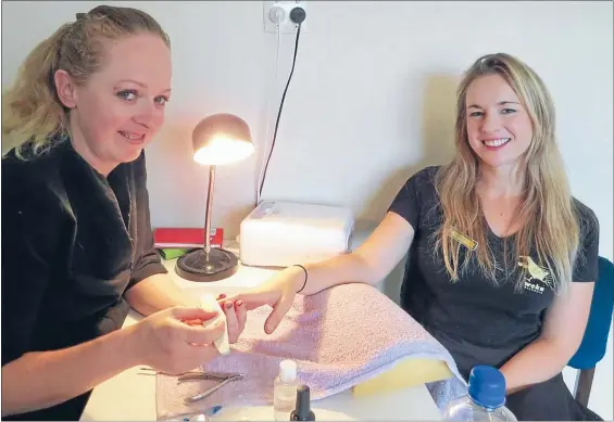  ??  ?? LONG TRAVELS: Devilskin’s lead singer Jennie Skulander, right, often visits her good friend Amanda Viviers in Tokoroa to get her nails done.