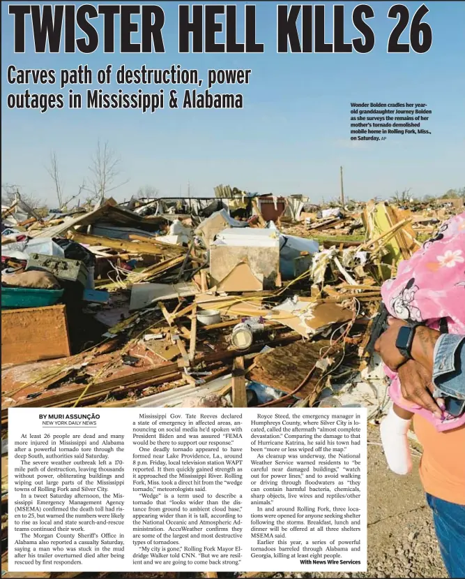  ?? AP ?? Wonder Bolden cradles her yearold granddaugh­ter Journey Bolden as she surveys the remains of her mother’s tornado demolished mobile home in Rolling Fork, Miss., on Saturday.