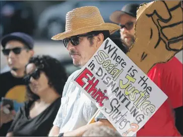  ?? Luis Sinco Los Angeles Times ?? PROFESSOR Elias Serna of the University of Redlands joins a 2019 rally to defend a proposed model curriculum that came under public criticism from multiple angles. California has been revising the model since.