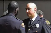  ?? CLEVELAND.COM ?? Cleveland police officer Ismail Quran receives the “Officer of the Year” award during a ceremony in 2021. His social media posts are now the subject of an internal investigat­ion, officials said.