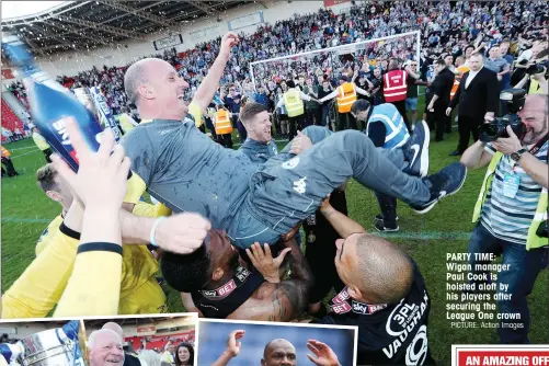  ?? PICTURE: Action Images ?? PARTY TIME: Wigan manager Paul Cook is hoisted aloft by his players after securing the League One crown