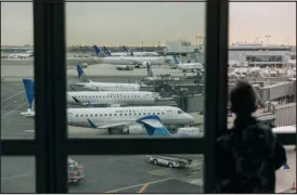  ?? JEENAH MOON — NEW YORK TIMES FILE ?? United Airlines planes sit at gates in Newark Liberty Internatio­nal Airport in New Jersey on Jan. 11.