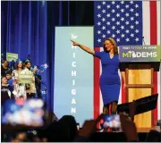  ?? NICK HAGEN — THE WASHINGTON POST ?? Secretary of State Jocelyn Benson points at the crowd at the Michigan Democrats post-midterm afterparty held at Sound Michigan Secretary of State Jocelyn Benson, pointing at the crowd during an election night gathering in Detroit, won reelection.