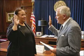  ?? GOVERNOR’S OFFICE ?? Robyn Crittenden is sworn in as Georgia interim secretary of state by Gov. Nathan Deal on Thursday. “I’m going to give this job my all,” she said.