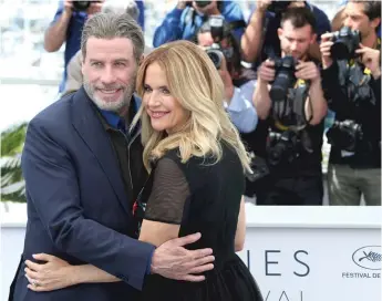  ?? GETTY IMAGES ?? ABOVE: John Travolta and wife Kelly Preston promote “Gotti” at the 2018 Cannes Internatio­nal Film Festival.
