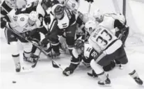  ??  ?? Avalanche forward CodyMcLeod ( 55) tries to reach the puck in traffic near the net during Friday night’s game against the Predators at the Pepsi Center. Andy Cross, The Denver Post