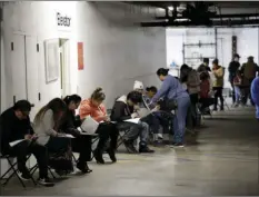  ?? PHOTO/MARCIO JOSE SANCHEZ
AP ?? In this March 13 file photo, unionized hospitalit­y workers wait in line in a basement garage to apply for unemployme­nt benefits at the Hospitalit­y Training Academy in Los Angeles. California’s unemployme­nt rate nearly tripled in April because of the economic fallout from coronaviru­s pandemic.