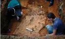  ??  ?? Anthropolo­gists at the University of South Florida exhume a grave at the Arthur G Dozier School for Boys in 2013. Photograph: Edmund D Fountain/AP