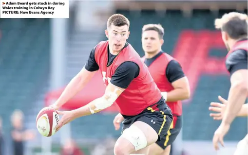  ??  ?? > Adam Beard gets stuck in during Wales training in Colwyn Bay PICTURE: Huw Evans Agency