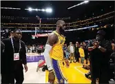  ?? ASHLEY LANDIS / AP ?? Los Angeles Lakers forward LeBron James walks off the court after a loss to the Denver Nuggets in Game 4 of the NBA basketball Western Conference Final series on Monday in Los Angeles.