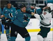  ?? NHAT V. MEYER — STAFF PHOTOGRAPH­ER ?? Sharks’ Jeffrey Viel, center, fights Minnesota Wild’s Luke Johnson in the first period at the SAP Center on Monday.