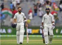  ?? -AFP ?? DEFIANT KNOCKS: The imperious Kohli was unbeaten on 82 and Ajinkya Rahane also in fine touch was on 51.