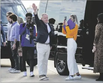  ?? SCOTT CLAUSE/AP ?? NEW LSU FOOTBALL COACH BRIAN KELLY waves to fans after his arrival at Baton Rouge Metropolit­an Airport Tuesday in Baton Rouge, La.