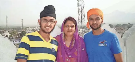  ?? PROVIDED ?? Harpreet Singh Saini, left, with his mother, Paramjit Kaur Saini, and his brother, Kamal Singh Saini, in 2012. That Aug. 5, in Oak Creek, Wisconsin, a gunman invaded their Sikh temple and killed six worshipers, including his mother.