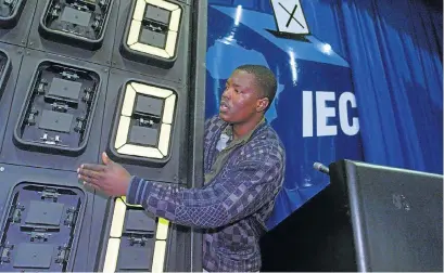  ?? /Reuters ?? The numbers game: A technician prepares in this file picture a results board at the Electoral Commission of SA headquarte­rs in Pretoria ahead of an election.