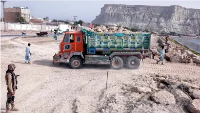  ?? Bloomberg ?? a truck delivers rocks to a developmen­t site in Gwadar. The Central asia will benefit from the China Pakistan Economic Corridor. —