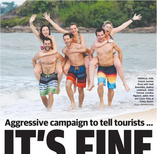  ?? Picture: BRENDAN RADKE ?? TROPICAL FUN: French tourists (from left) Hadi Bourokba, Audrey Lamirault, Julien Frencel, Caroline Rigourd, Julien Anis and Laure Vitre at Trinity Beach.