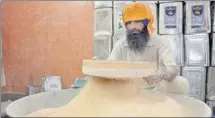  ??  ?? SECRET INGREDIENT: A sewadar sieving semolina flour that is more granular than normal flour. In Sikhism, it is a tradition to prepare the parshad while reciting the Gurbani or doing ‘jaap’ chanting Satnam Wahe Guru.