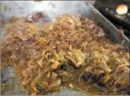  ?? FILE PHOTO ?? In this file photo, a pile of caramelize­d onions wait to be made into sliders at Jack’s Drive In.