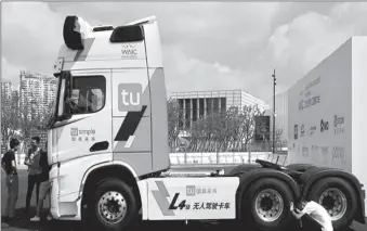  ?? -AP ?? A self-driving truck of TuSimple displayed at an industry expo in China.