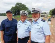  ??  ?? The U.S. Coast Guard Auxiliary promotes safe recreation­al boating. From left are flotilla Commander Paul Berger, division officer Chris Hoffman and Bert Dodge.