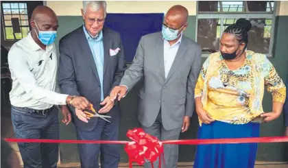  ?? ?? Inkosi Mathaba, Cllr Stan Larkan, Chairman and MD of Tronox South Africa and Saudi Arabia - Mpho Mothoa and SL Masinga get ready to officially open the Thekelimfu­ndo Primary School classrooms and kitchen