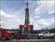  ?? KEITH SRAKOCIC — THE ASSOCIATED PRESS FILE ?? Work continues in March at a shale gas well drilling site in St. Mary’s, Pa. The fracking process has raised environmen­tal concerns while turning the state into a major energy producer.