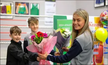  ?? ?? Siofra Kenny is presented with two bouquets of flowers.