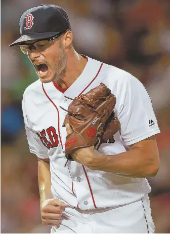 ?? STAFFPHOTO­BYMATTWEST ?? NEW ROLE: Starter-turned-reliever Joe Kelly reacts after finishing the seventh inning of the Red Sox’ 4-2 loss to the Tigers last night at Fenway Park.