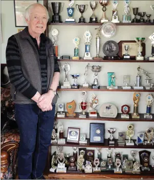  ??  ?? Padraic Maye with some of his many trophies.