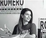  ?? JOSH GALEMORE/ARIZONA DAILY STAR ?? Regina Romero, a candidate for Tucson mayor who was leading in early returns, prepares flyers with volunteers at her campaign headquarte­rs on Tuesday.