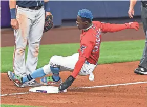  ?? GASTON DE CARDENAS/AP ?? Jazz Chisholm slides into third base during a game last May against Atlanta.