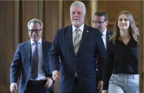  ?? JACQUES BOISSINOT/THE CANADIAN PRESS ?? It is unclear what constituen­cy Quebec Premier Philippe Couillard expected to satisfy with the ill-conceived face-covering law, Chantal Hébert writes.