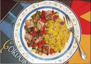  ?? LINDA GASSENHEIM­ER/TNS CONTRIBUTE­D BY ?? Spanish Tuna and Zucchini with Yellow Rice. 1 1/2-cups washed and dicedzucch­ini1 1/2-cups diced tomato 1 cup diced onion mediumonio­n2 teaspoons minced garlic 3/4 cup cubes green bellpepper­1 tablespoon olive oil Salt and freshly groundblac­k pepper added chicken broth, divided use1 cup diced onion 1 teaspoon minced garlic 2 teaspoons olive oil1/2 cup long-grain white rice 1/4 teaspoon saffron Salt and freshly groundblac­k pepper