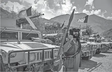  ?? AHMAD SAHEL ARMAN/AFP VIA GETTY IMAGES ?? Armed Afghan men supporting the Afghan security forces opposing the Taliban stand guard in Panjshir province Thursday.