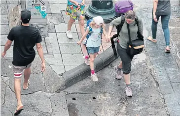  ??  ?? WATCH YOUR STEP: The Khao San Road landscape developmen­t will create a pleasant street that is safe to walk along, advocates say. One of the new features will be repaved footpaths.