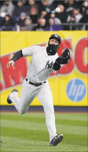  ?? Julie Jacobson / Associated Press ?? Yankees right fielder Giancarlo Stanton makes a catch on a fly ball by the Blue Jays’ Lourdes Gurriel Jr. during the seventh inning on Friday.