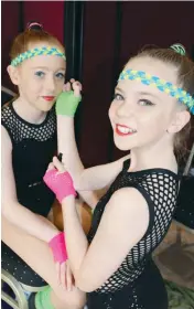  ??  ?? Above: Ayrlee Smith helps duo partner Hayley Shankland with some makeup prior to hitting the stage. The girls attend Upstaged Dance in Pakenham.Left: All smiles are (from left) Holly Phillips of Drouin, Maggie Dargan of Moe and Ruby-Lee Krieger and Emma McDougal of Warragul. The girls are from KC’s School of Dance.