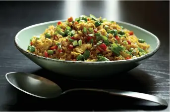  ?? Tribune News Service ?? ■ A few leftovers and bottled sauces are all it takes to make crave-worthy fried rice.