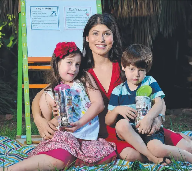  ??  ?? GOOD DEEDS: Marissa Schulze with Eleni, 6, and Billy, 4, uses a chart system to reward them with $1 for chores. Picture: BIANCA DE MARCHI