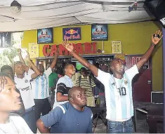  ??  ?? Argentina fans celebrate after a goal is scored.