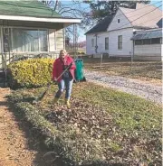  ?? CONTRIBUTE­D PHOTO ?? Christie Helton of the Erlanger Heart and Lung Institute helps rake a widow’s leaves in Brainerd.