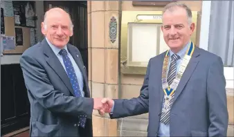  ??  ?? John McDowall, left, hands over to new president Andrew Ronald.