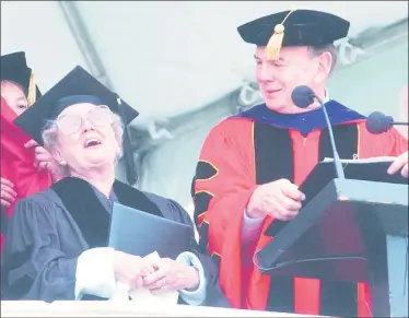  ?? Hearst Connecticu­t Media file photos ?? Wesleyan University President Douglas Bennet, right, looks on as Doreen Freeman receives her honorary doctor of humane letters degree during the school’s May 2003 commenceme­nt in Middletown.